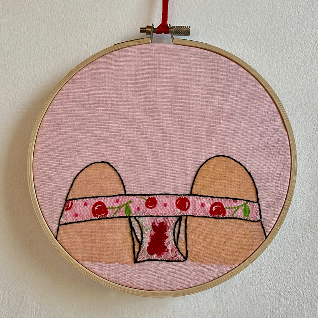 an embroidery of underwear covered in blood